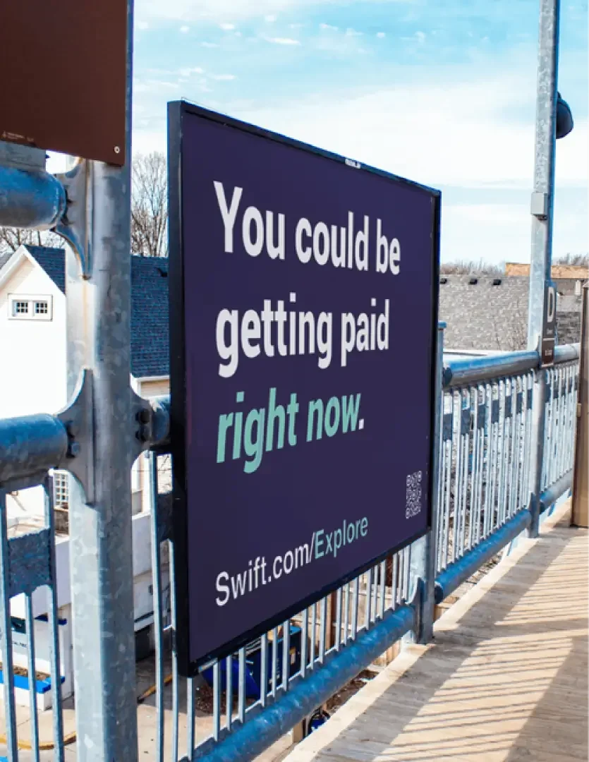Mockup of train station poster from Swift marketing campaign
